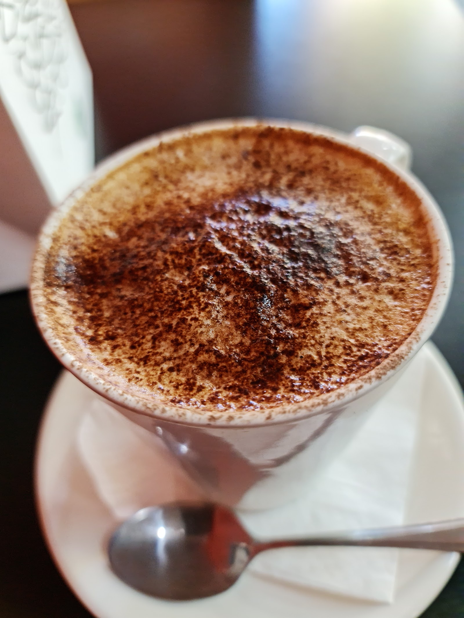 A chocolate-dusted cappuccino at The Larder Cafe