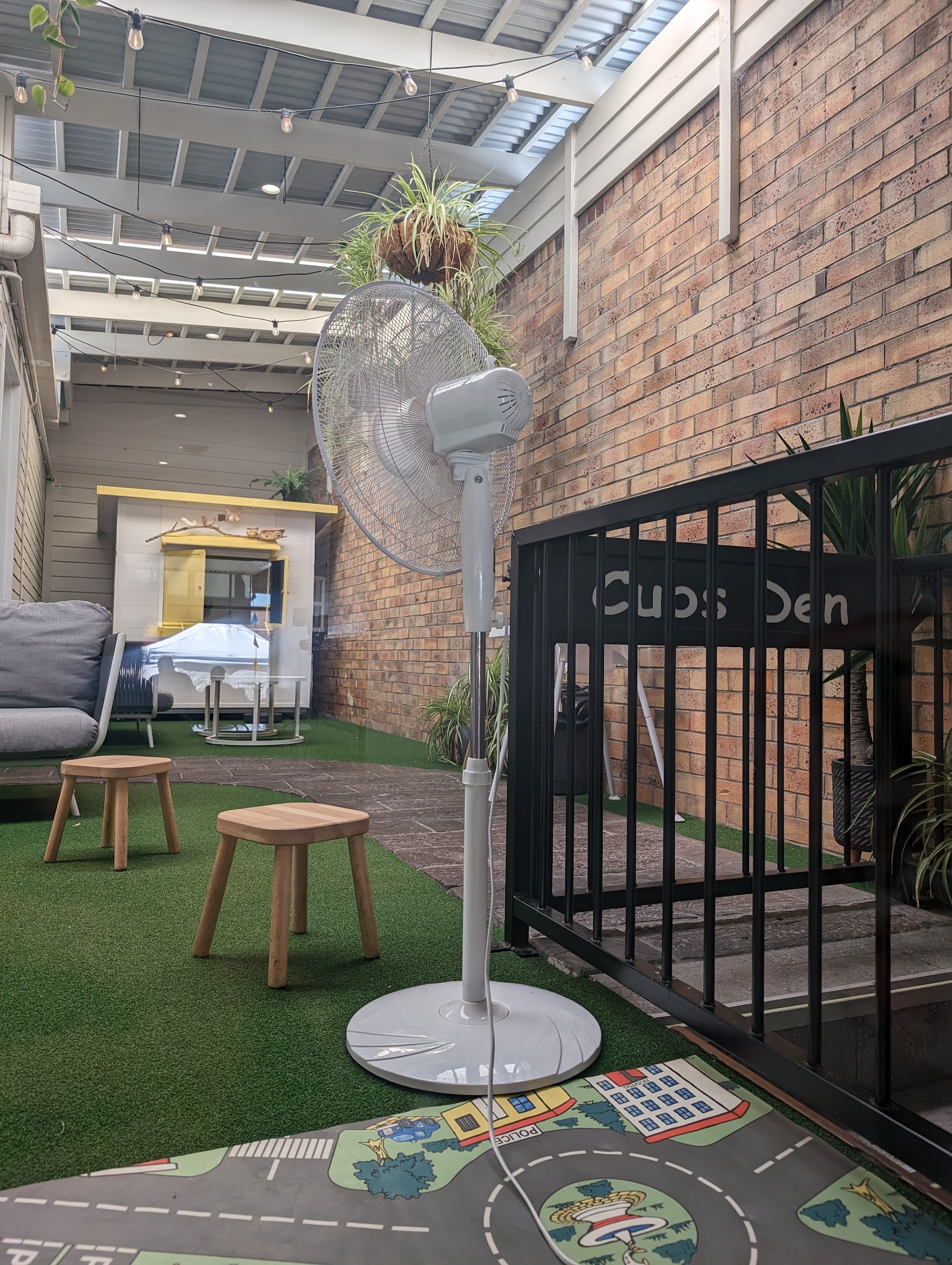 The Cubs Den outdoor kids play courtyard at the back of the bakery