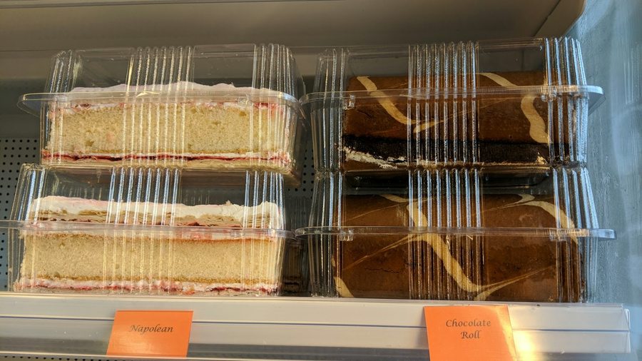 Cake slices including Napoleon and chocolate roll in the O'Donnell's Bakehouse display case
