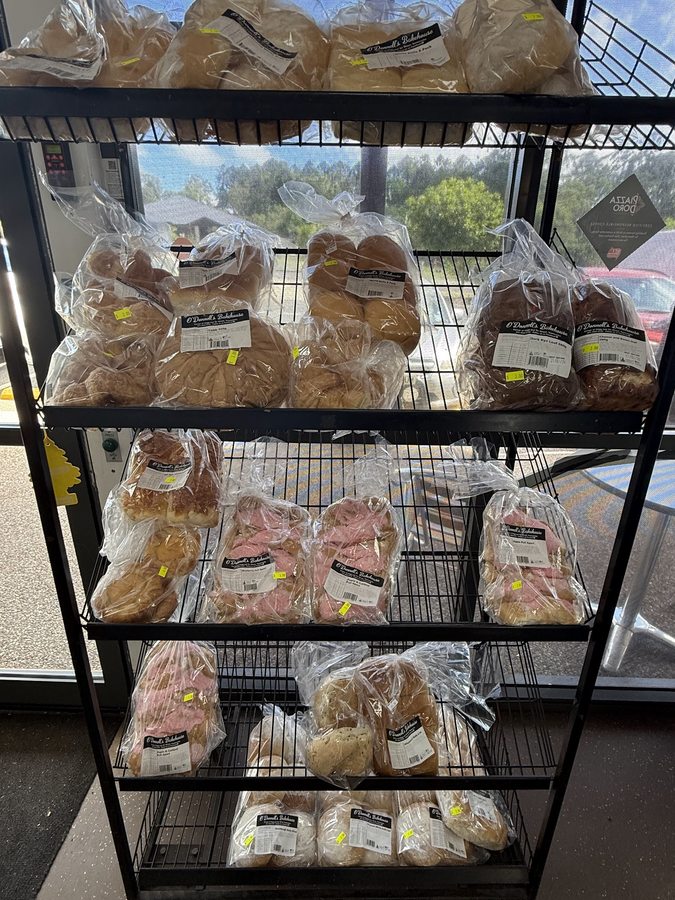 Freshly baked own-brand bread loaves and rolls on the shelf at O'Donnell's Bakehouse