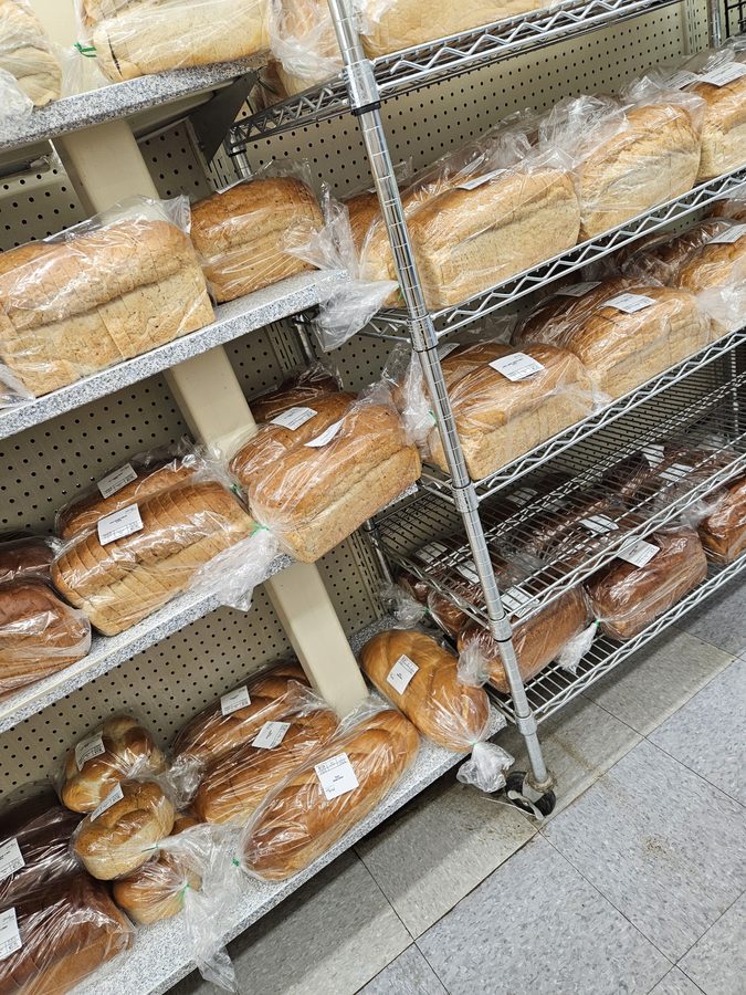 Shelves of fresh-baked bread at S&L Bakery