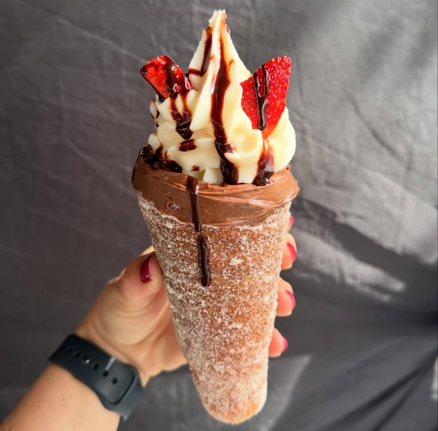 Chimney cake with strawberries and chocolate drizzle