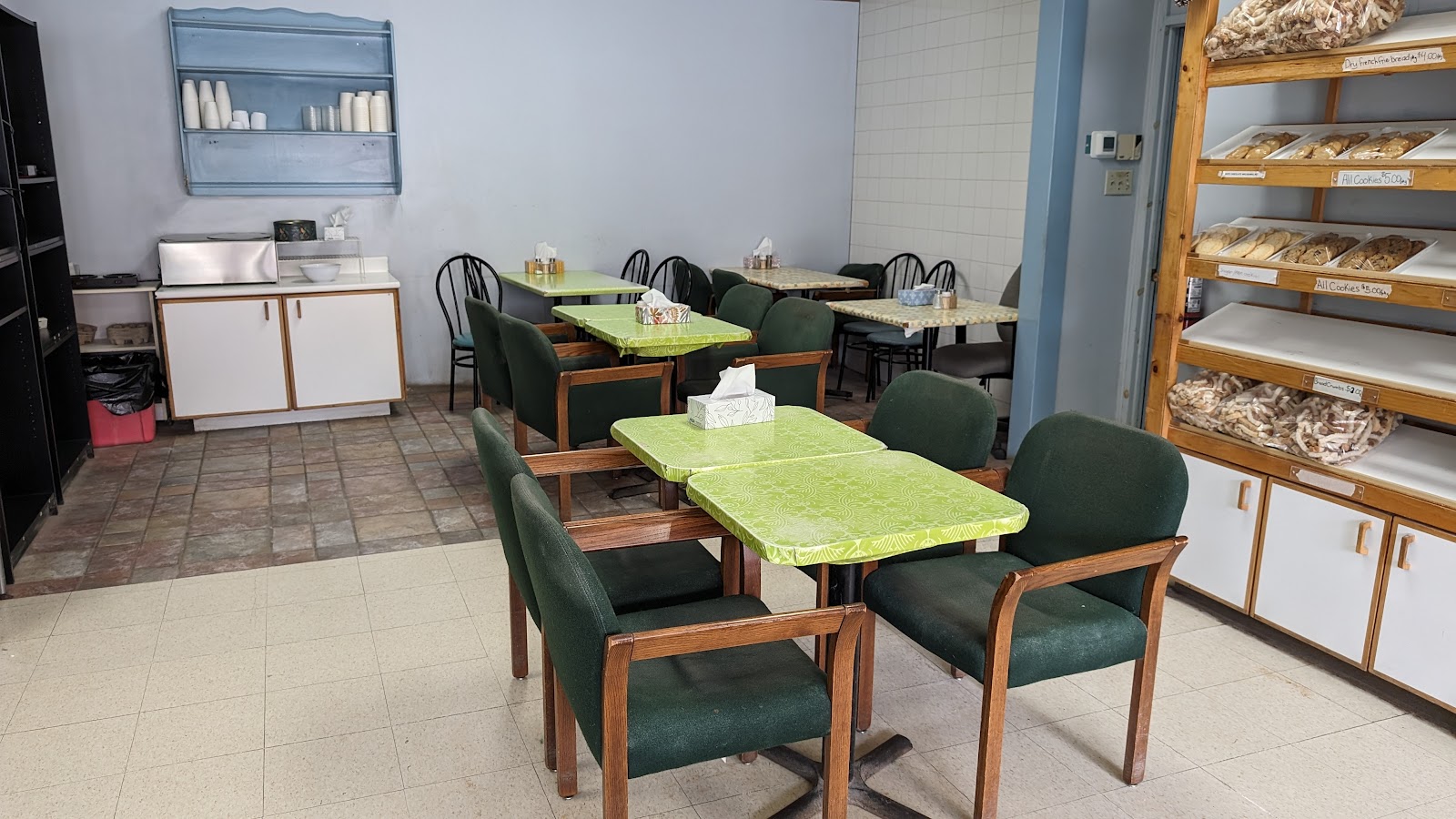 Inside Carp Bakery — café seating beside racks of fresh-baked bread