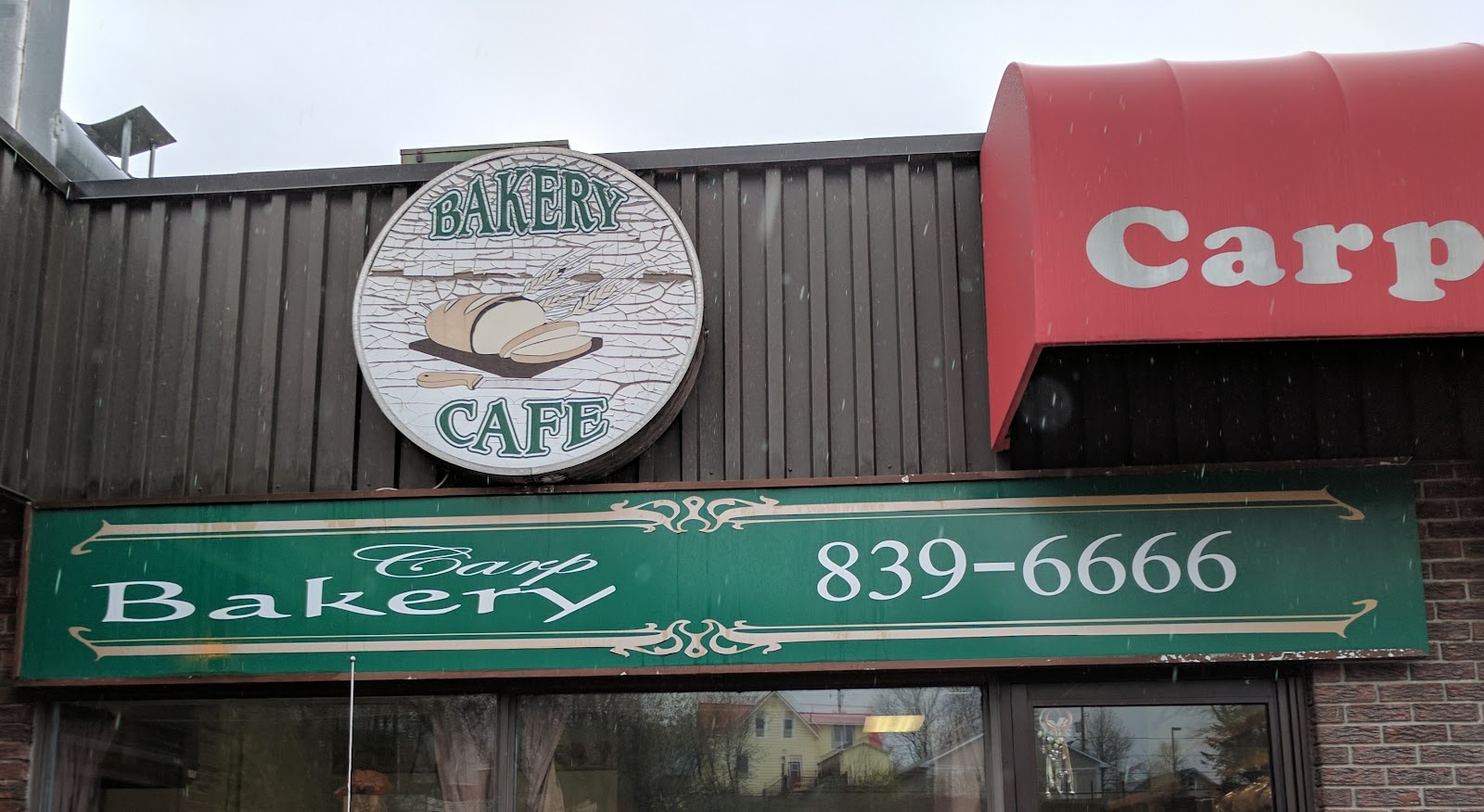 Carp Bakery storefront sign and green fascia