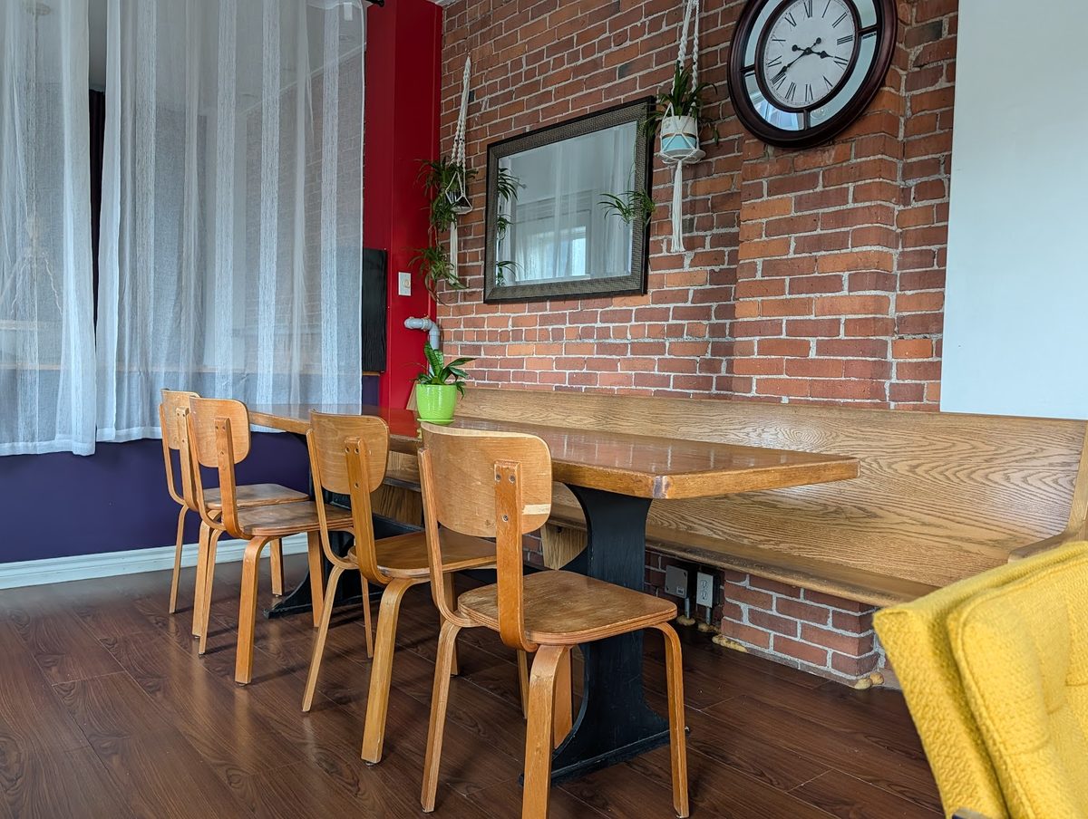 Exposed-brick seating area inside the pâtisserie