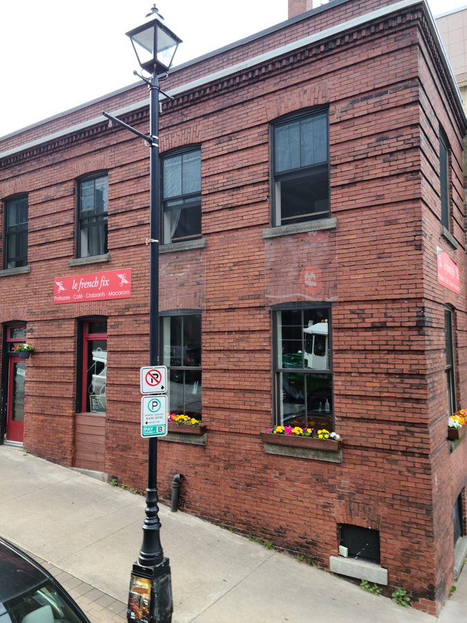 Le French Fix storefront sign on a brick building in Downtown Halifax