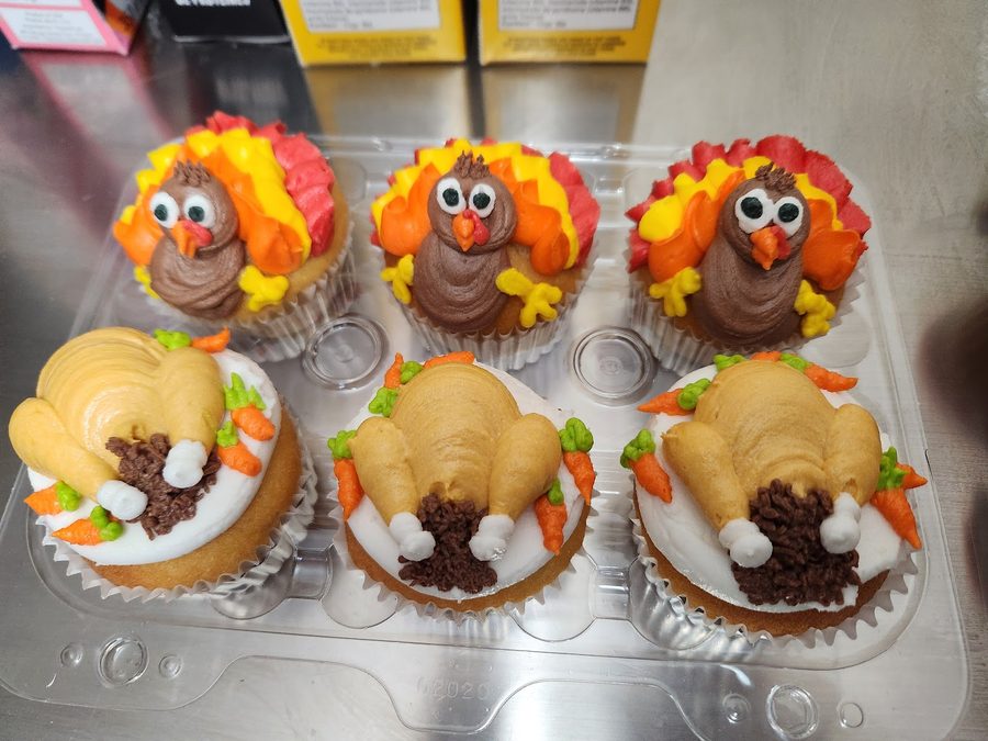 Hand-decorated Thanksgiving turkey cupcakes.
