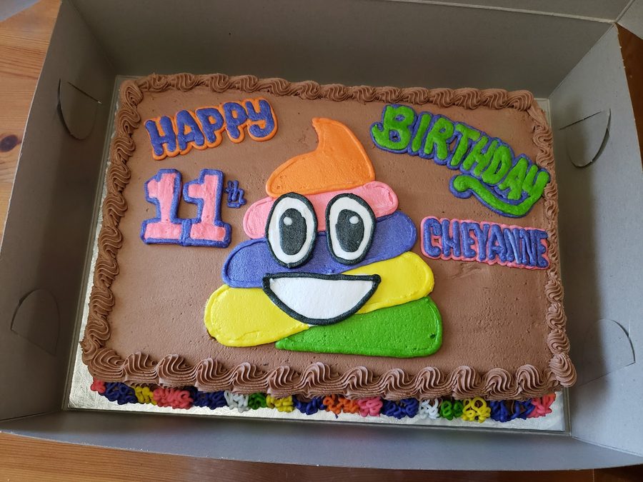 A chocolate emoji birthday sheet cake.