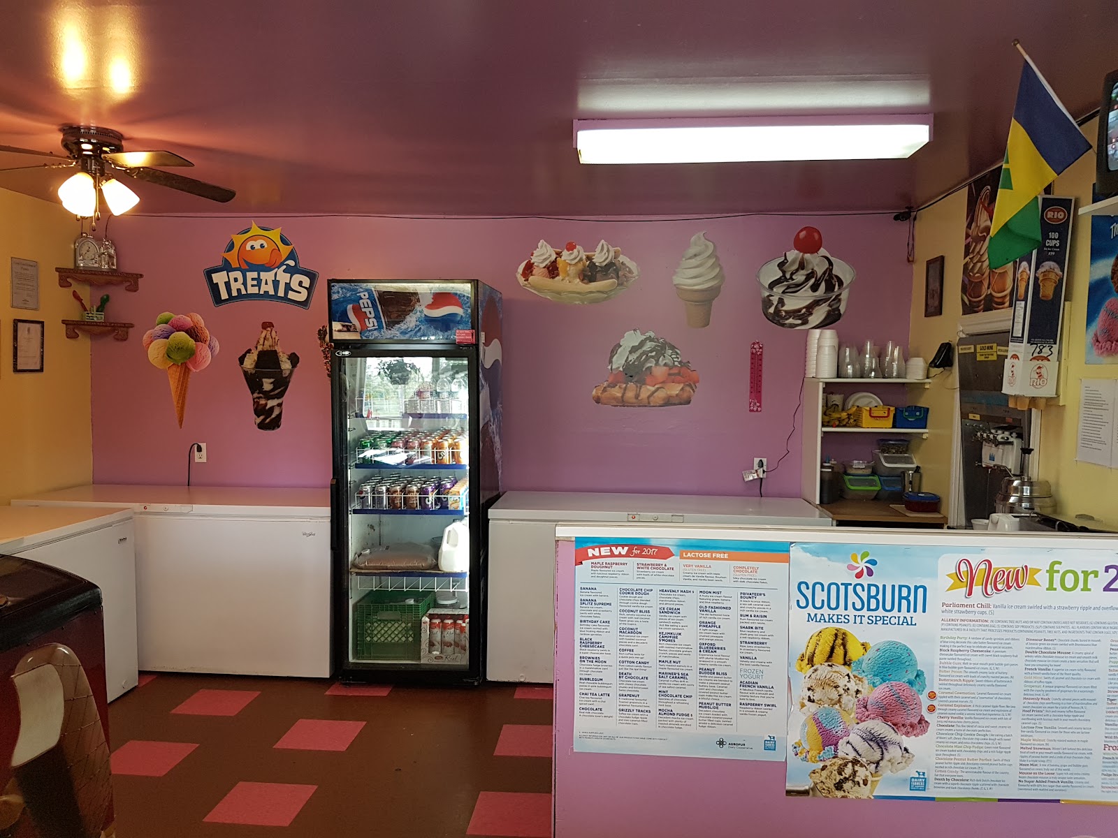 Inside Corina's Ice Cream Parlour showing the menu boards and soft-serve counter