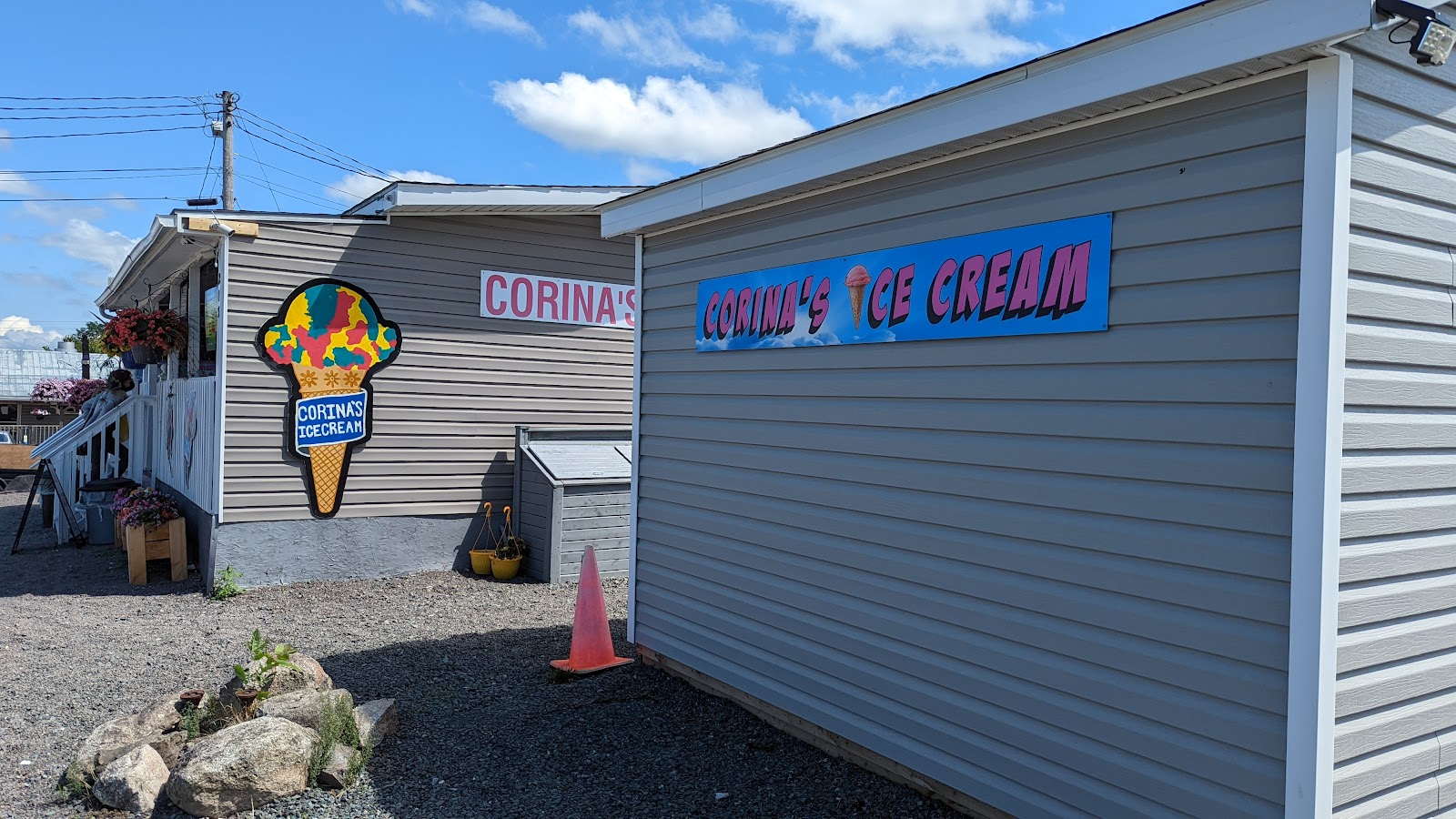 Corina's Ice Cream Parlour storefront with painted cone signage on Foord Street