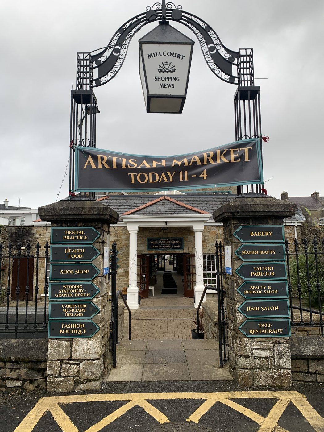 Millcourt Mews entrance and the artisan-market directory board