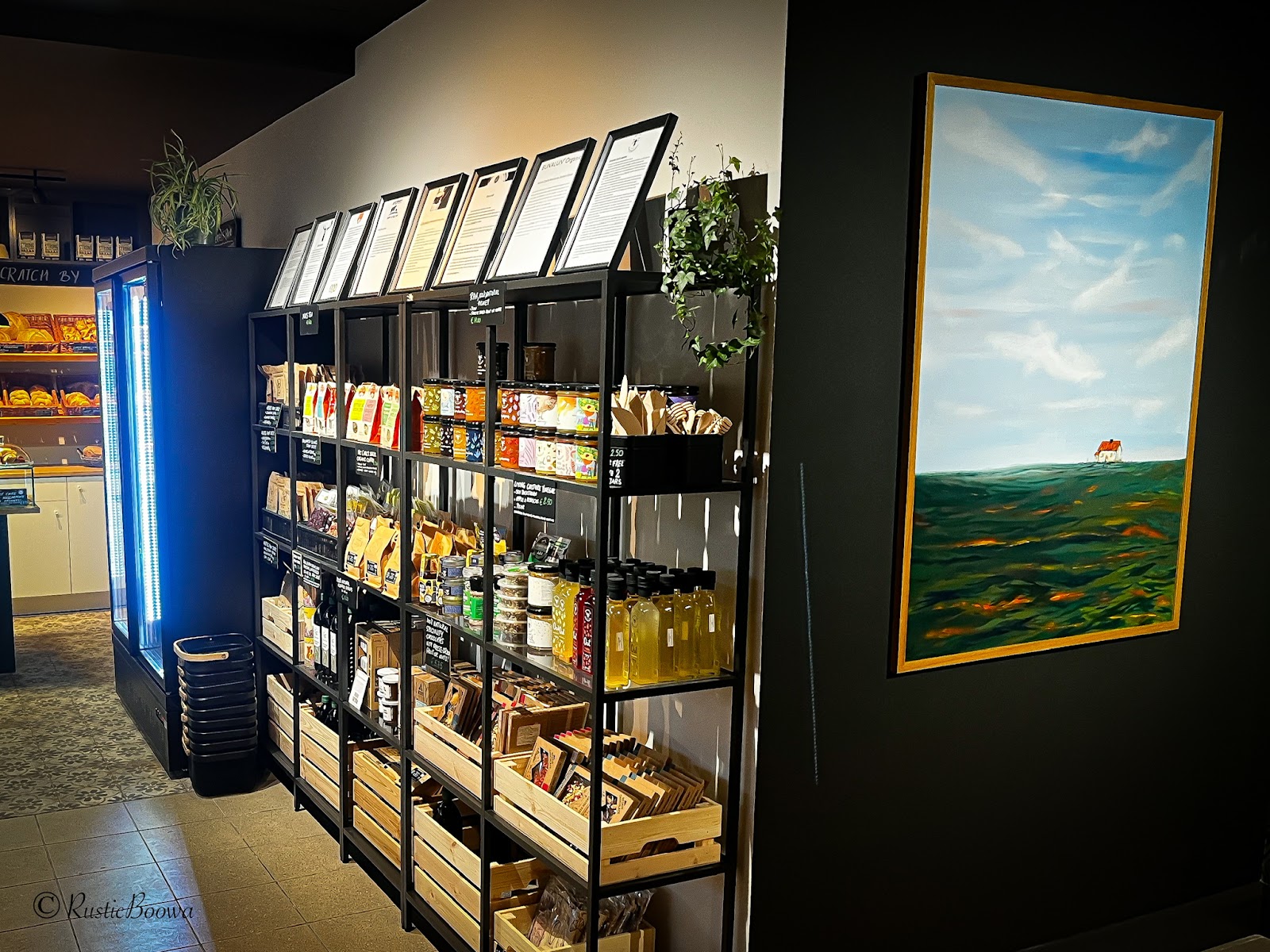 Inside Rustic Boowa — shelves of fresh bread and the chalkboard menu