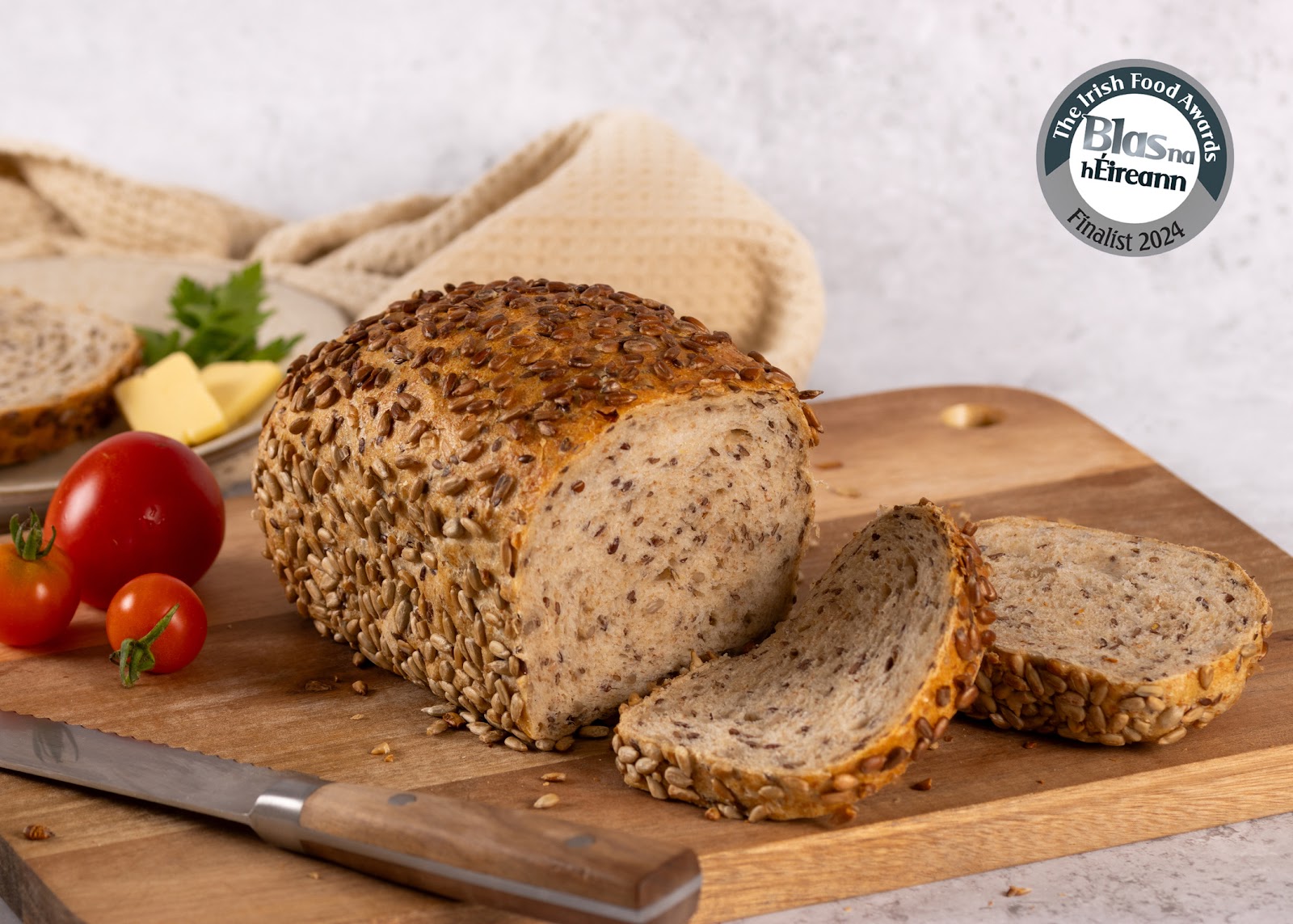 Freshly sliced rustic sourdough loaf on a board
