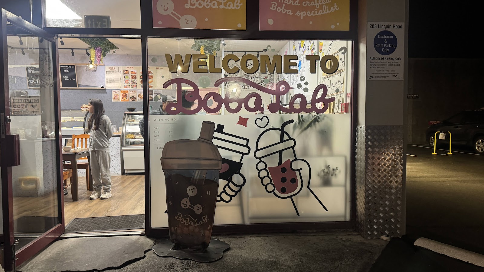 The BobaLab storefront at 283 Lincoln Road, Addington, at night.
