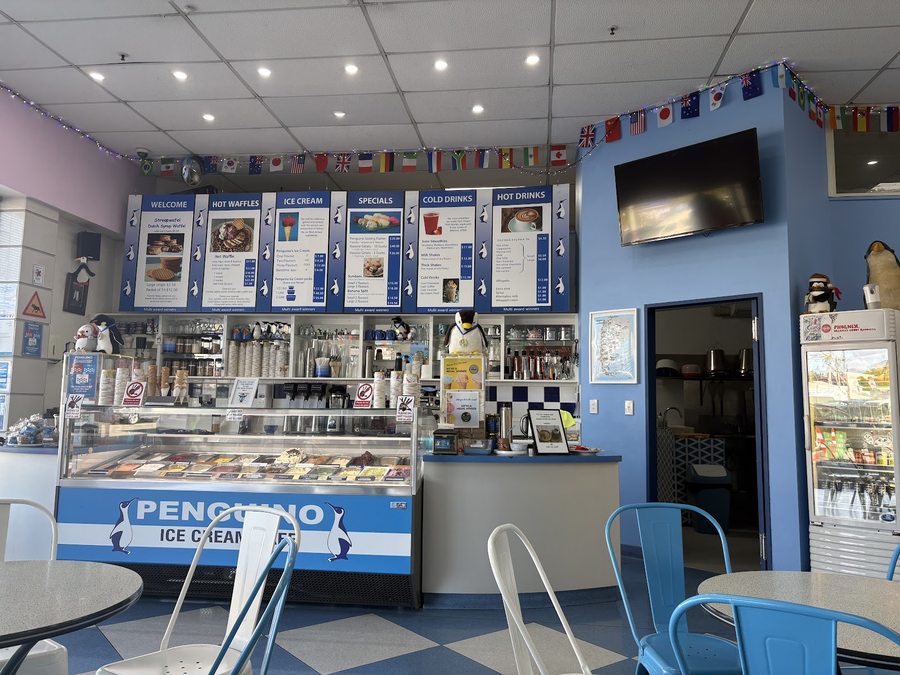 Inside Penguino Ice Cream Cafe: the counter, menu boards and gelato cabinet