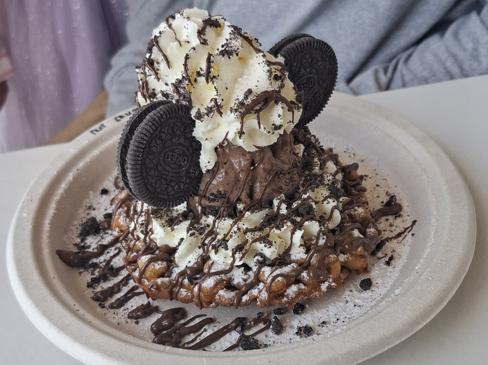 Funnel cake with deep-fried Oreos, whipped cream and ice cream