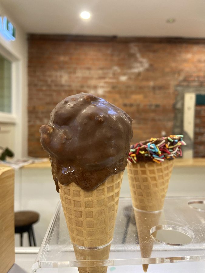 Two freshly dipped waffle cones made in-store at Frosty Moons