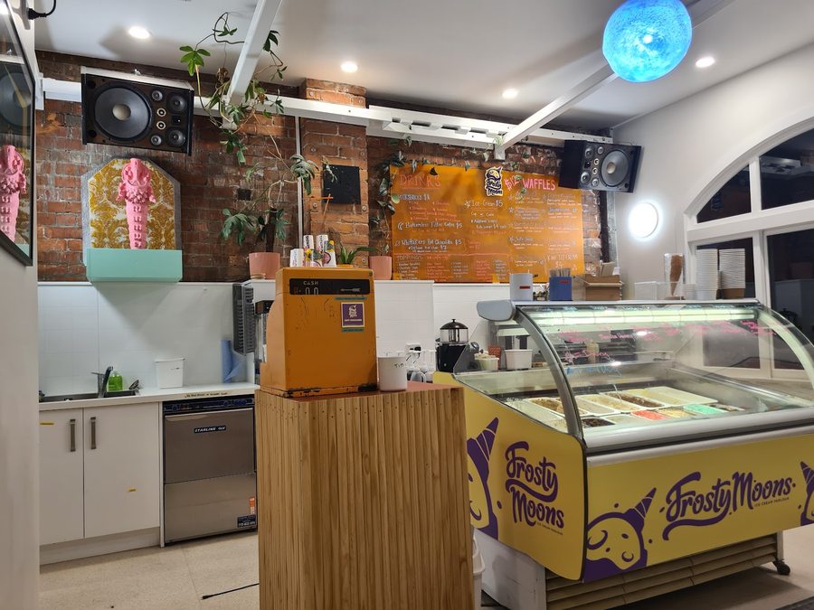 Frosty Moons branded gelato cabinet and chalkboard menu