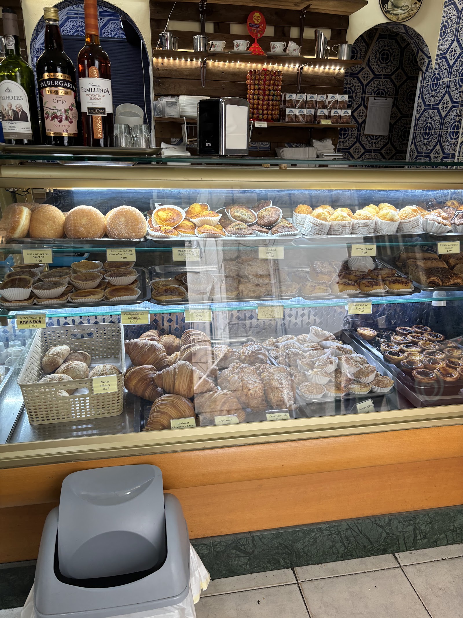 Display case of assorted Portuguese pastries at the counter