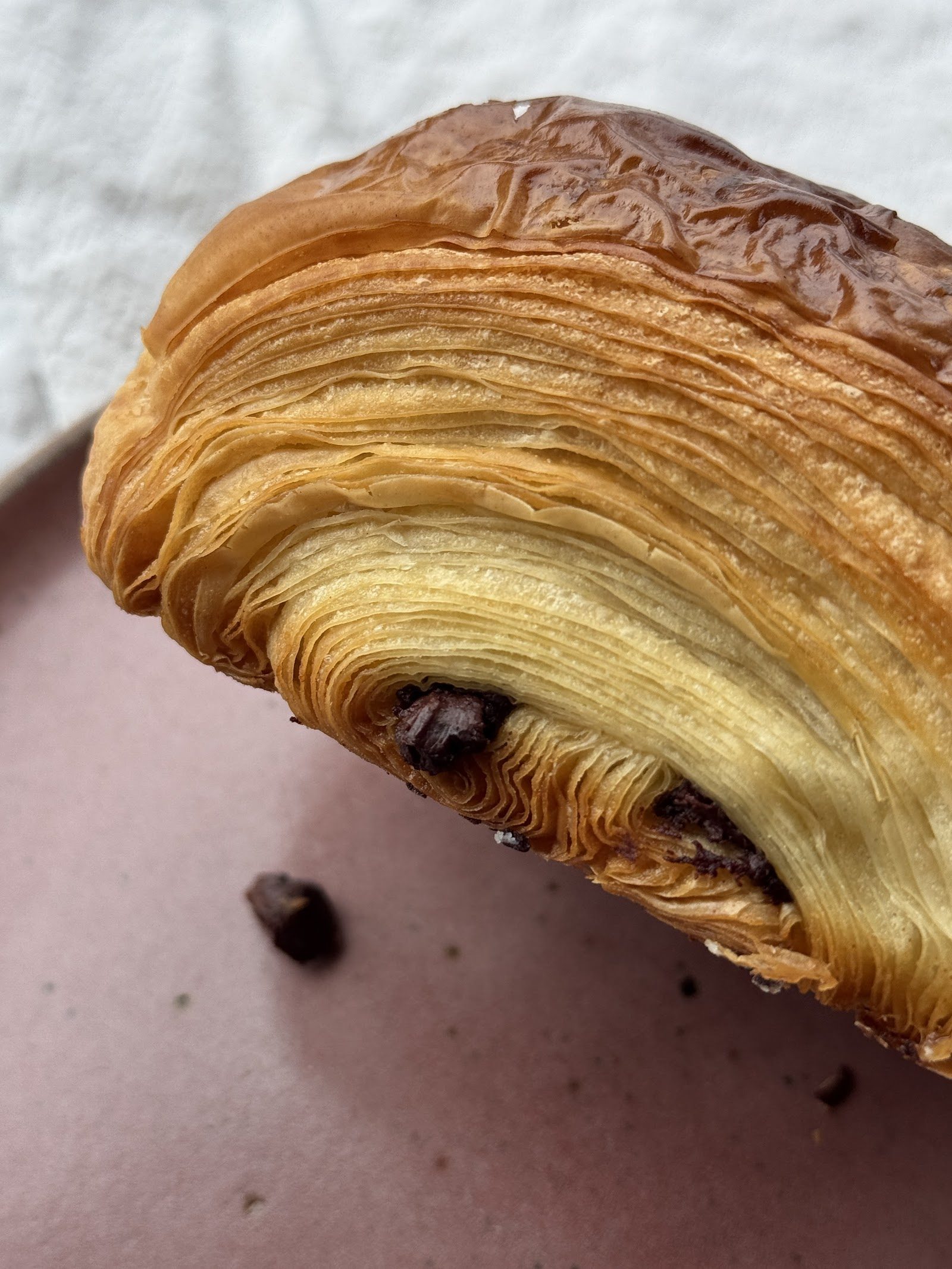 Cross-section of Flori Bakery viennoiserie showing fine lamination