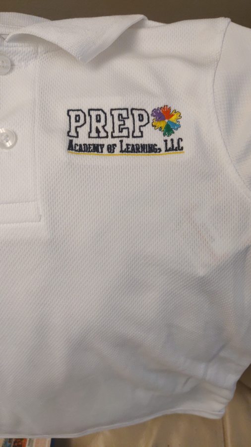 Close-up of an embroidered chest logo stitched onto a custom polo shirt