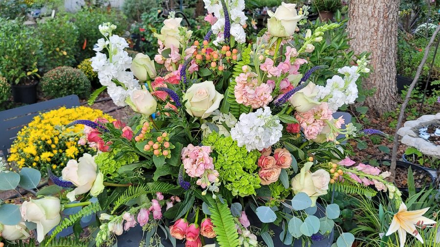Hand-arranged floral bouquet with roses and hydrangea