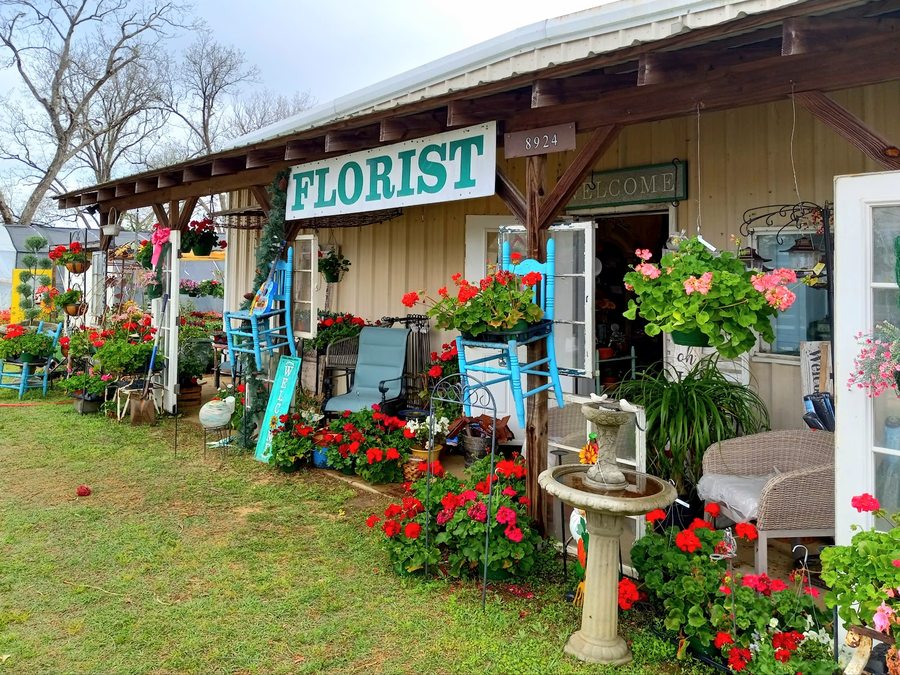 The Mad Potter storefront with FLORIST sign and welcome porch