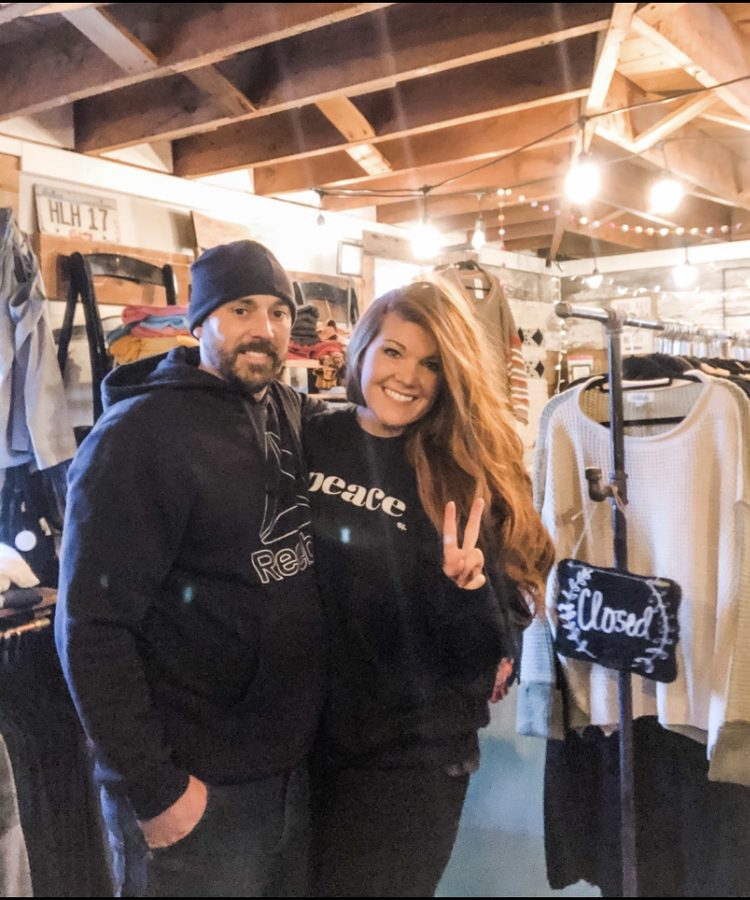 Inside the shop — racks of curated clothing and home goods with shoppers browsing