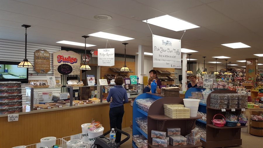 The taffy and fudge counter at Pony Tails, with pick-your-own taffy and fudge signs