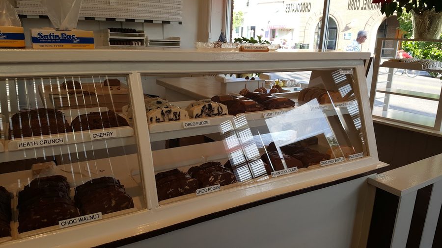 The labeled Howse's Fudge display case with rows of hand-cut flavors