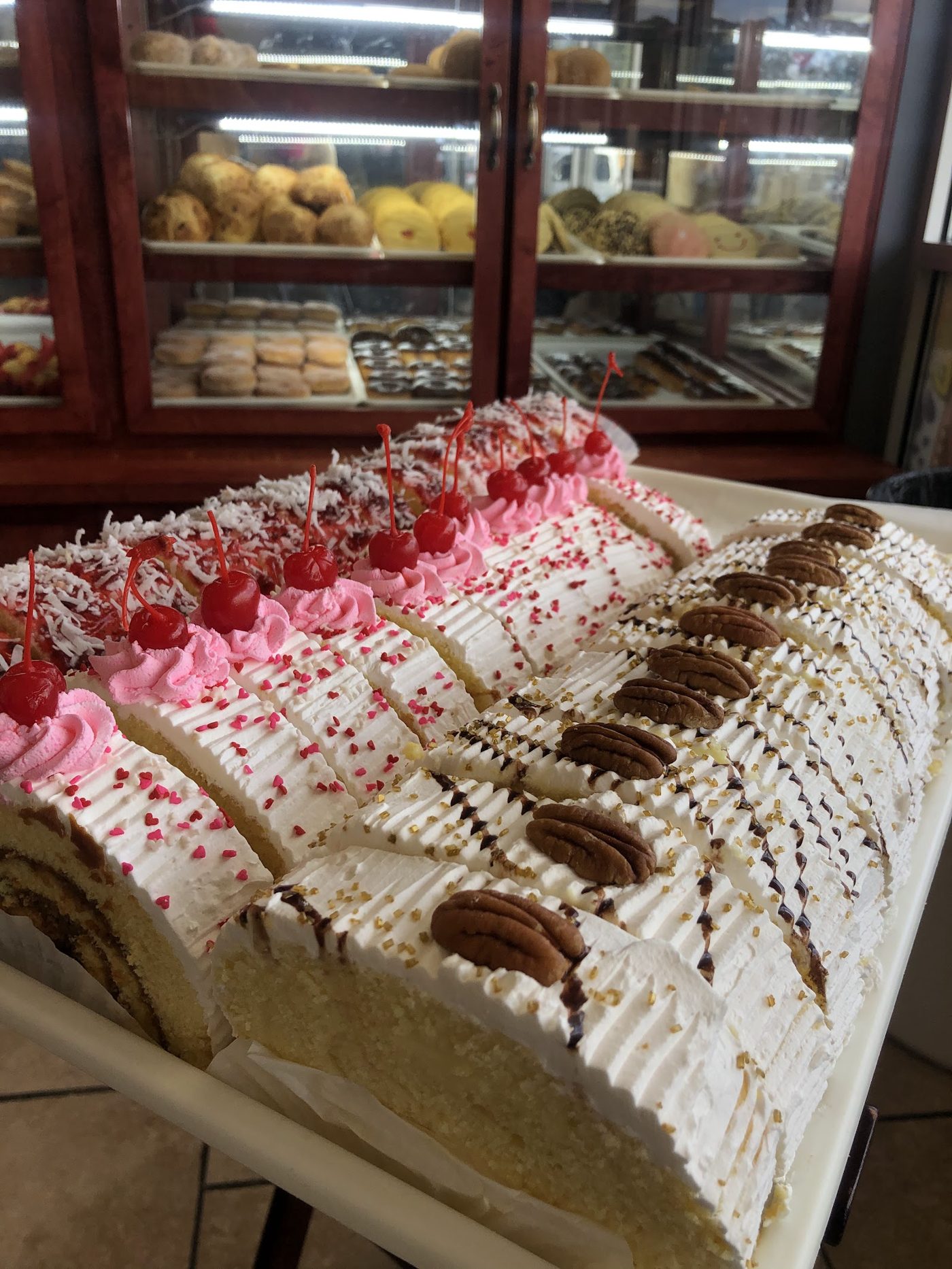 Slices of tres leches and pastel cakes