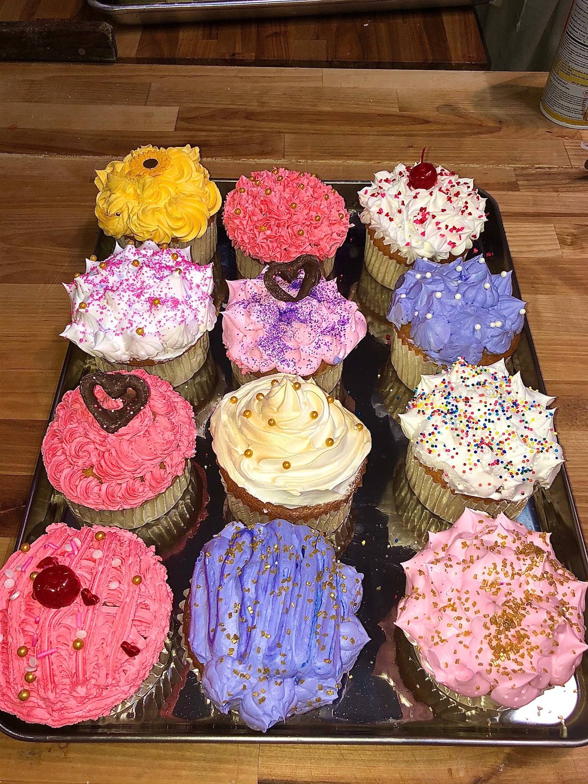 Tray of decorated cupcakes