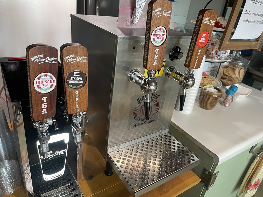 Nitro coffee and tea taps behind the counter at Sadie's Sweet Shop.