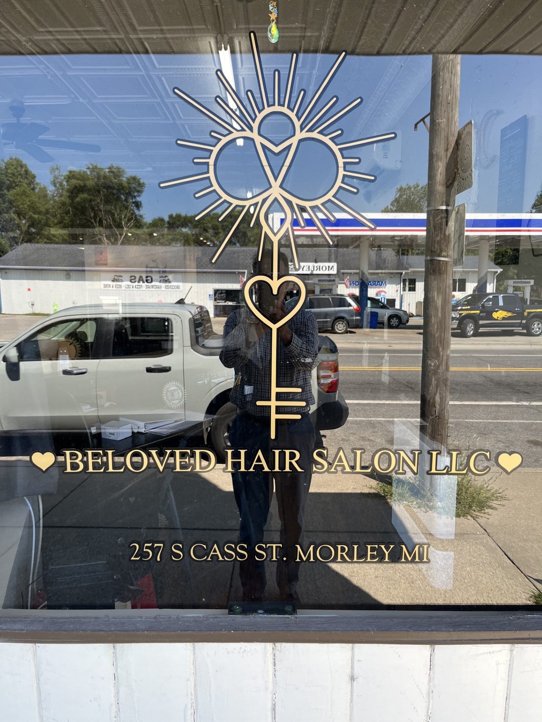 BeLoved Hair Salon storefront on S Cass Street in Morley, Michigan, with the gold emblem etched on the window