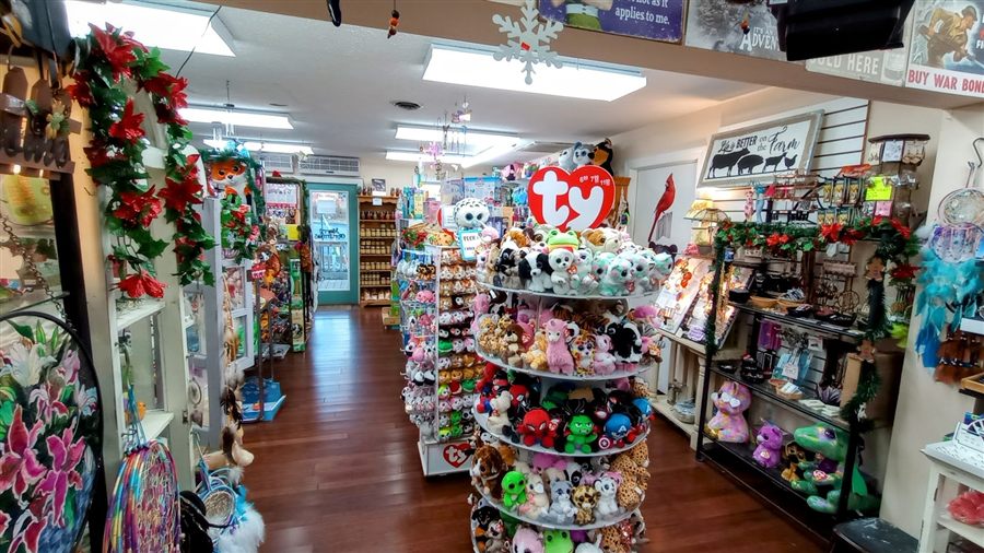 An aisle of plush toys, dreamcatchers and novelty gifts inside the shop