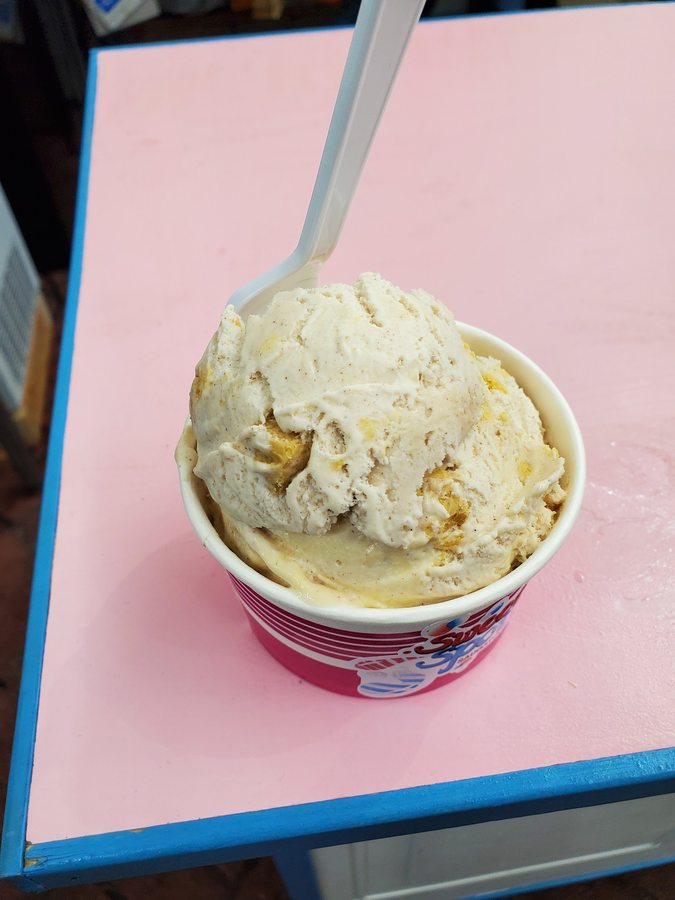 Scoop of ice cream in a branded Sweet Spot paper cup