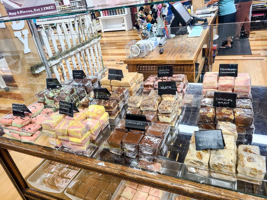 Handmade fudge display case with hand-labeled flavors at Aunt Millie's